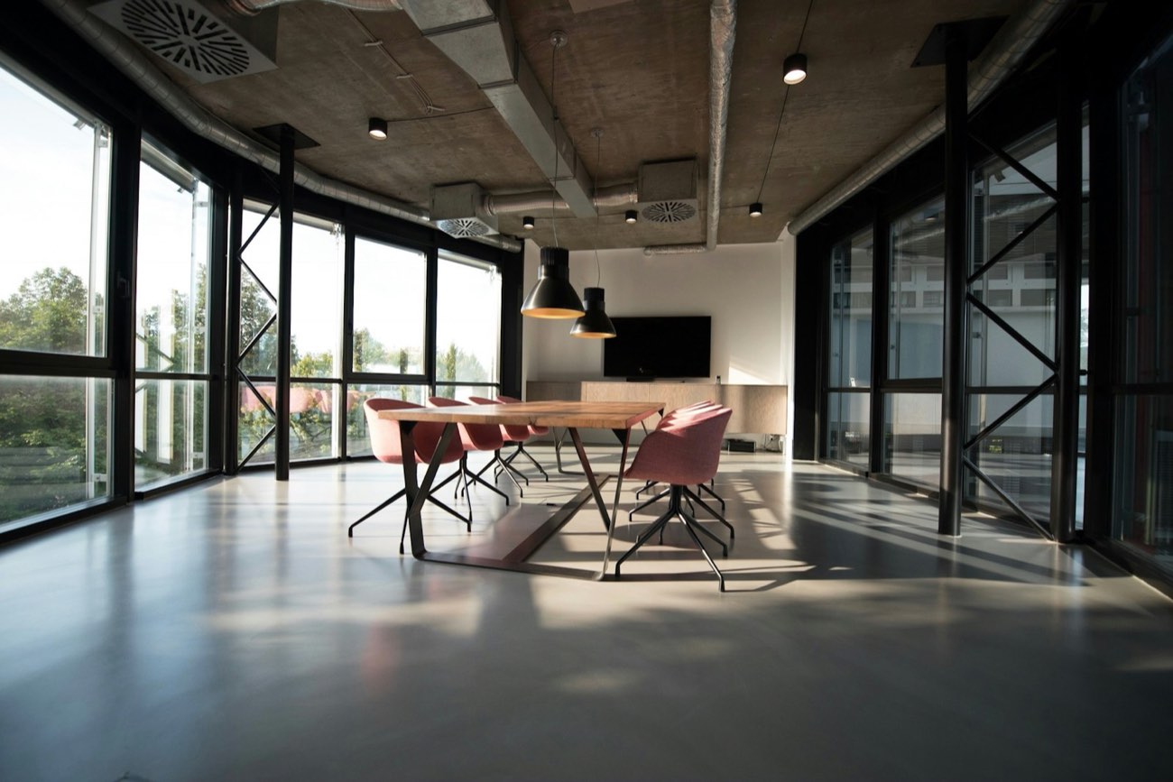 Open commercial office space with exposed-ceiling build-out
